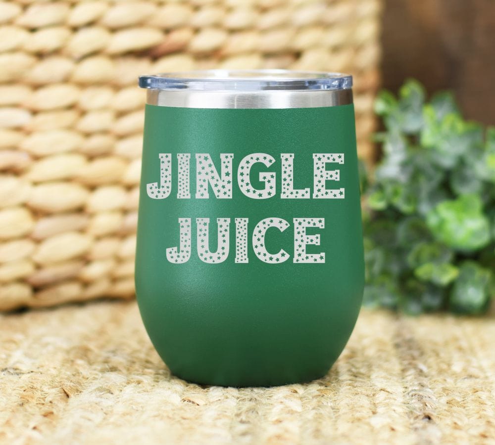 12oz laser engraved Christmas wine tumbler with jingle juice engraved. wording has little stars running throughout.
