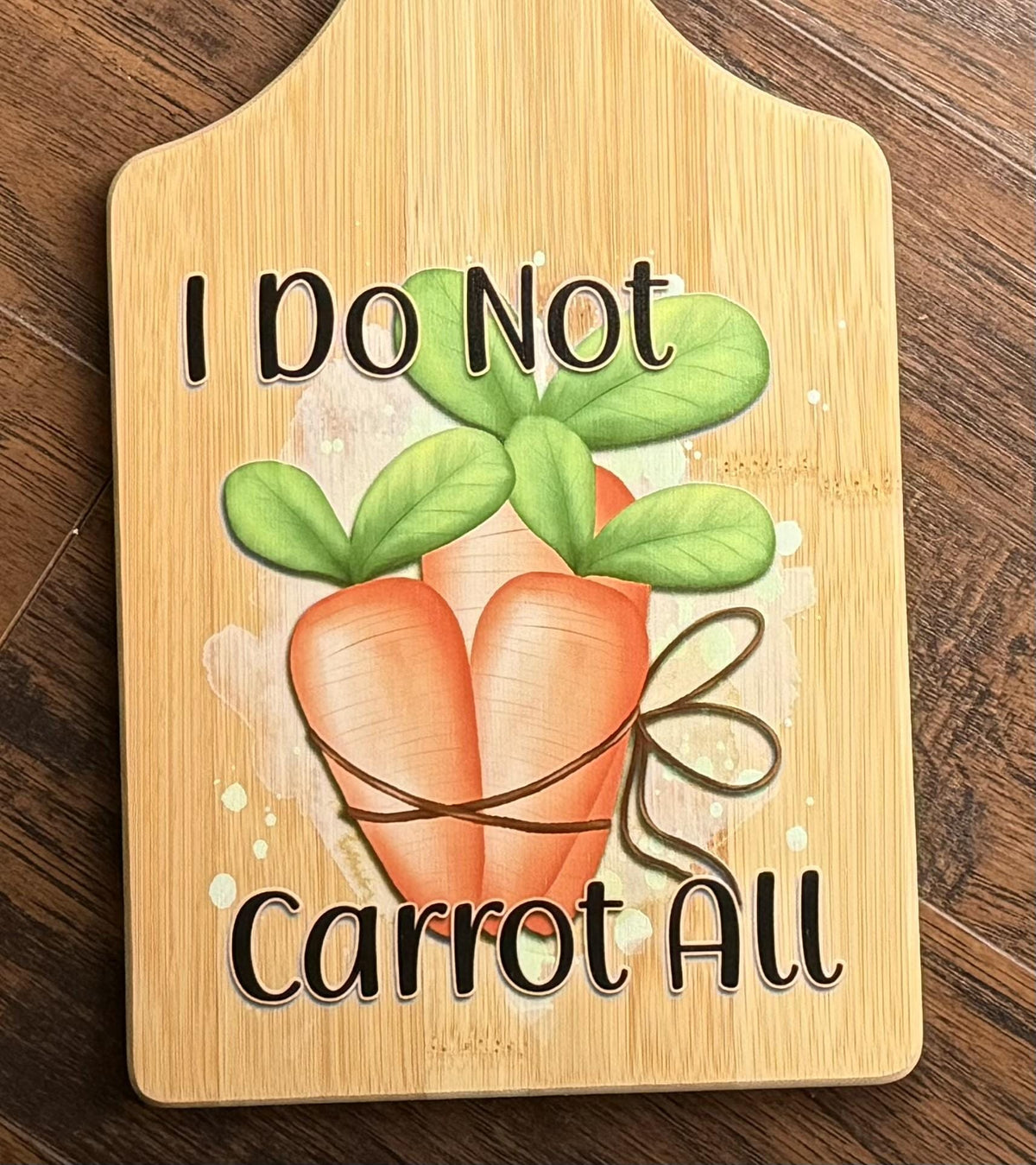 Decorative bamboo paddle board with carrot illustration and the words “I Do Not Carrot All”.