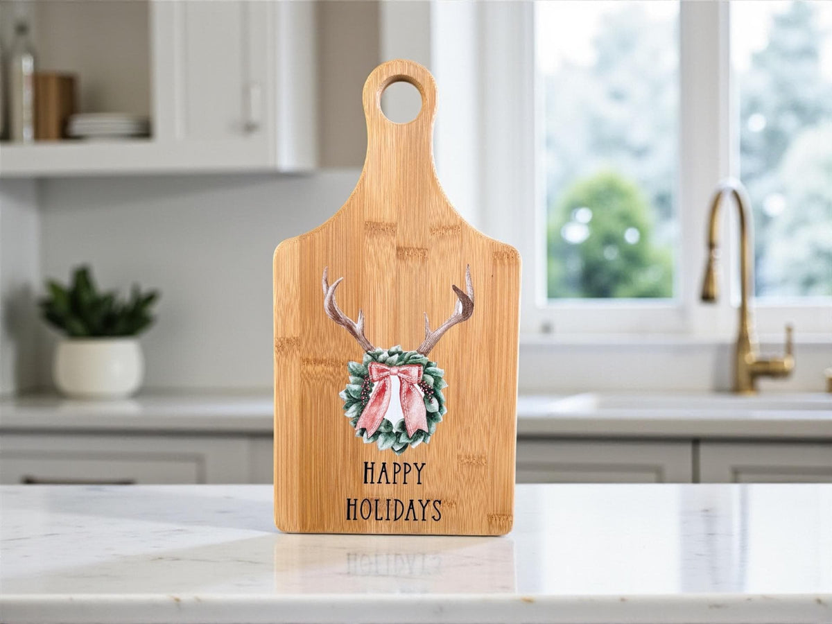 Decorative bamboo paddle board with antler wreath with a bow.