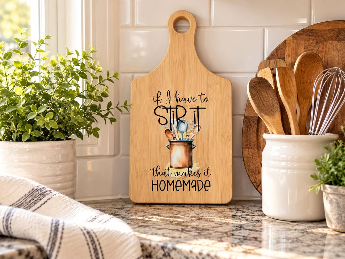 Decorative bamboo paddle board with humorous lettering and the words “If I Have to Stir It, That Makes It Homemade”.