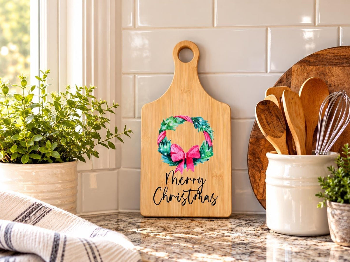Decorative bamboo paddle board with Christmas design and the words “Merry Christmas”.