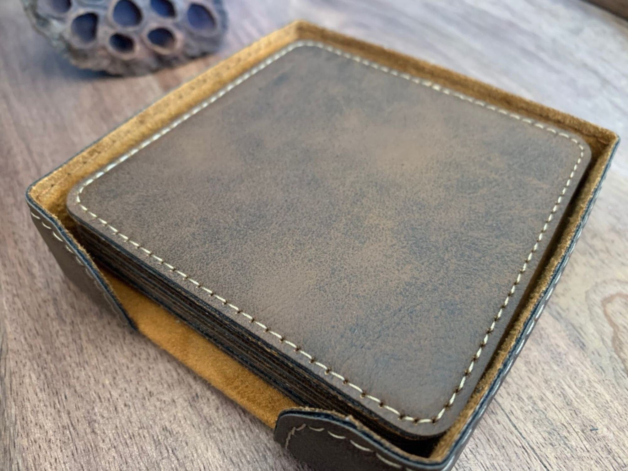 side angle view of leatherette coasters and holder