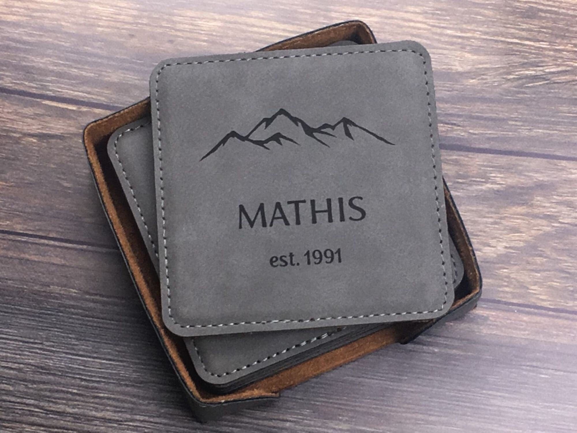leatherette coaster set engraved with mountain design personalized with last name and est. year