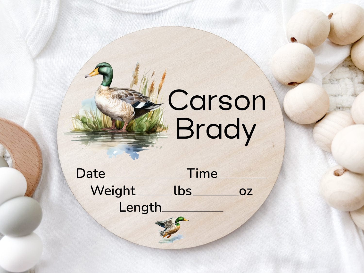 round wood baby name announcement sign. comes with mallard duck design, personalized with baby name and room to write in birth stat info