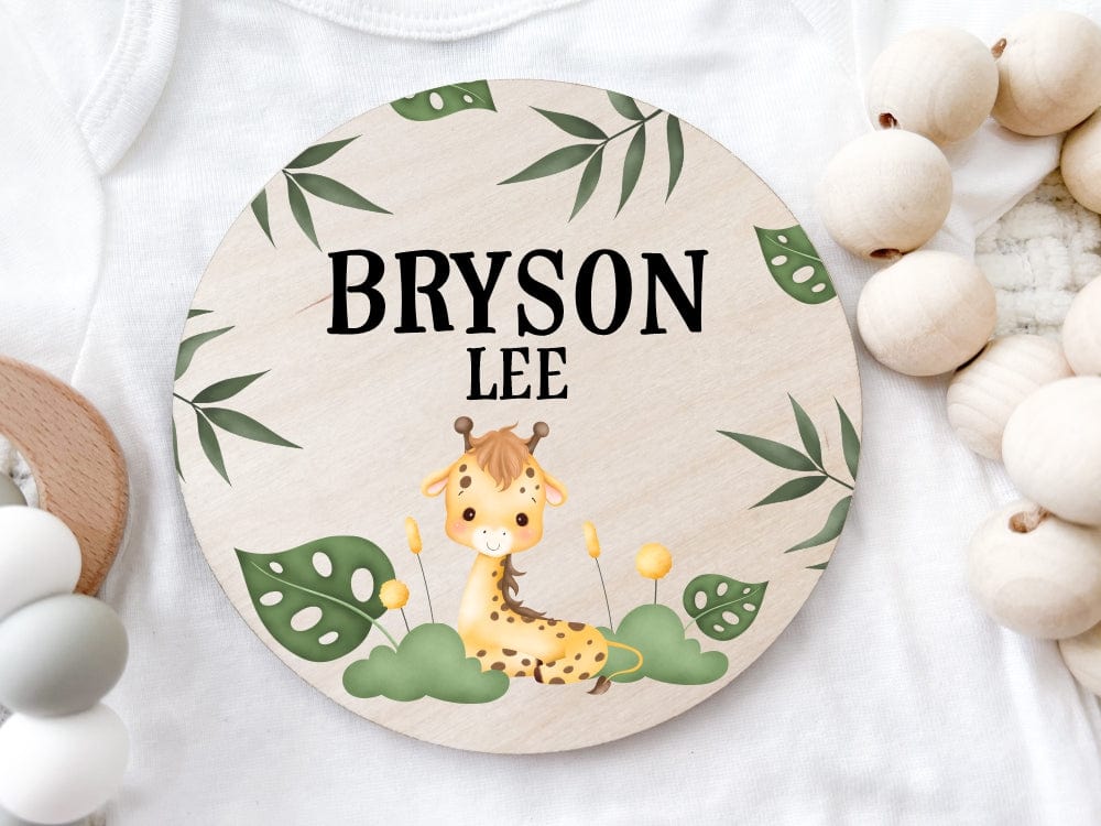 wood baby name announcement sign with baby Giraffe and green leaves personalized with baby first and middle names