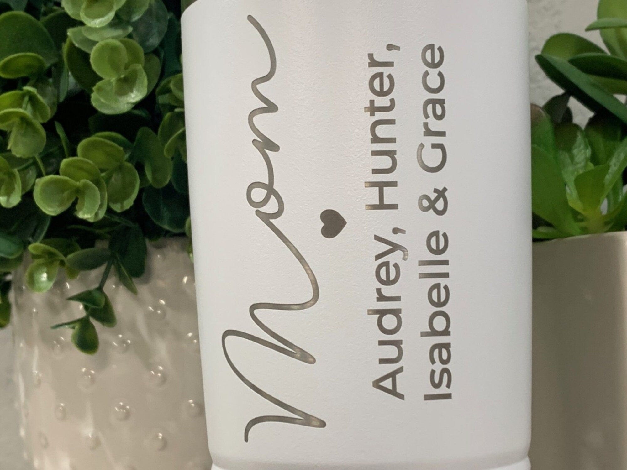 https://www.runwildengraving.com/cdn/shop/files/run-wild-engraving-20-oz-names-engraved-mom-tumbler-with-kids-names-mom-travel-mug-mom-christmas-gift-idea-from-kids-coffee-cup-for-mom-mother-s-day-gift-20oz-to-go-34868372373671.jpg?v=1684596420