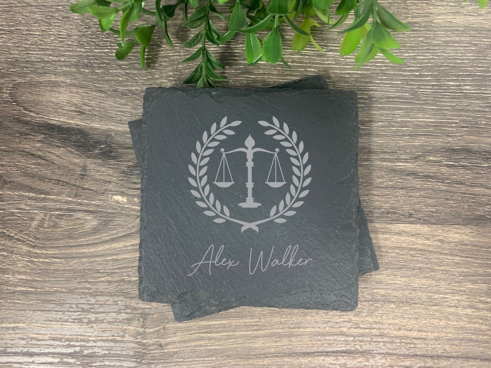 slate coasters engraved with scales of justice, wreath and personalized with name