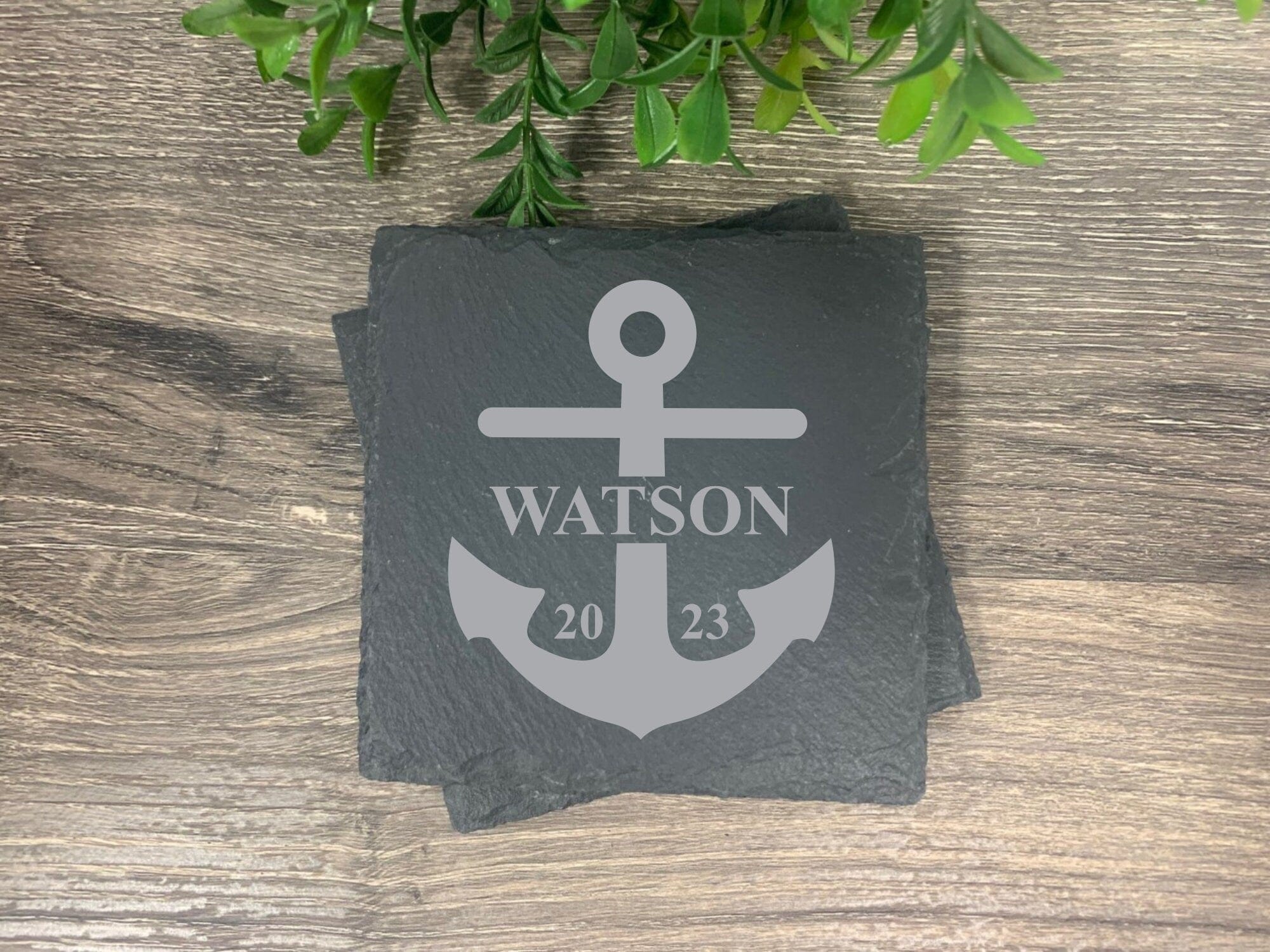 slate coasters engraved with anchor, last name and established year